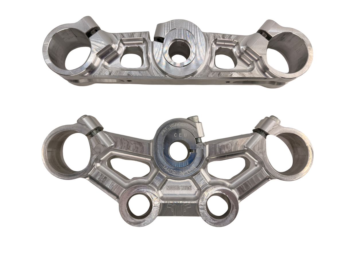 Killer Shox silver adjustable clamp pair — original product photograph on white