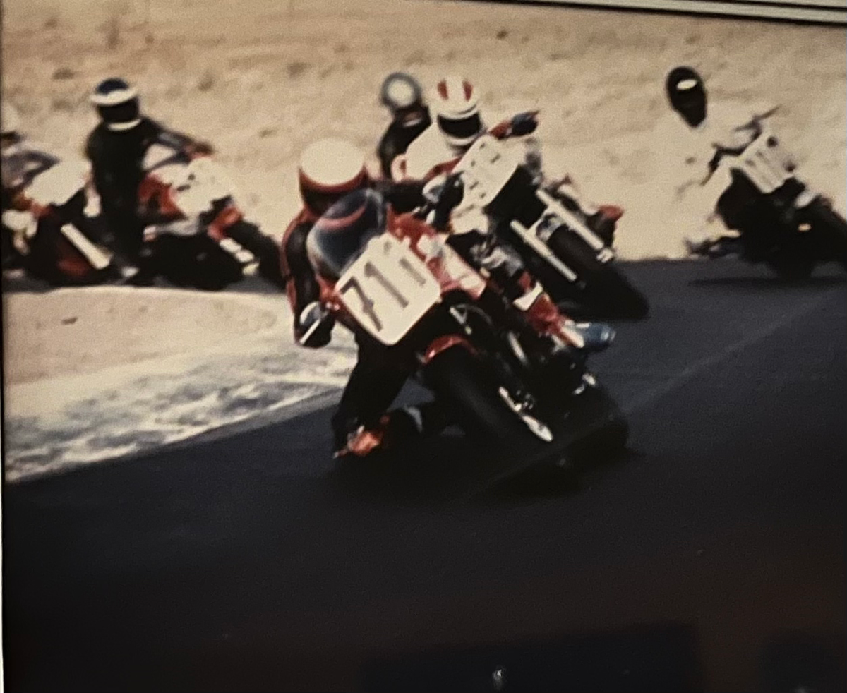 Archival motorcycle road racing photograph from American Suspension's company history